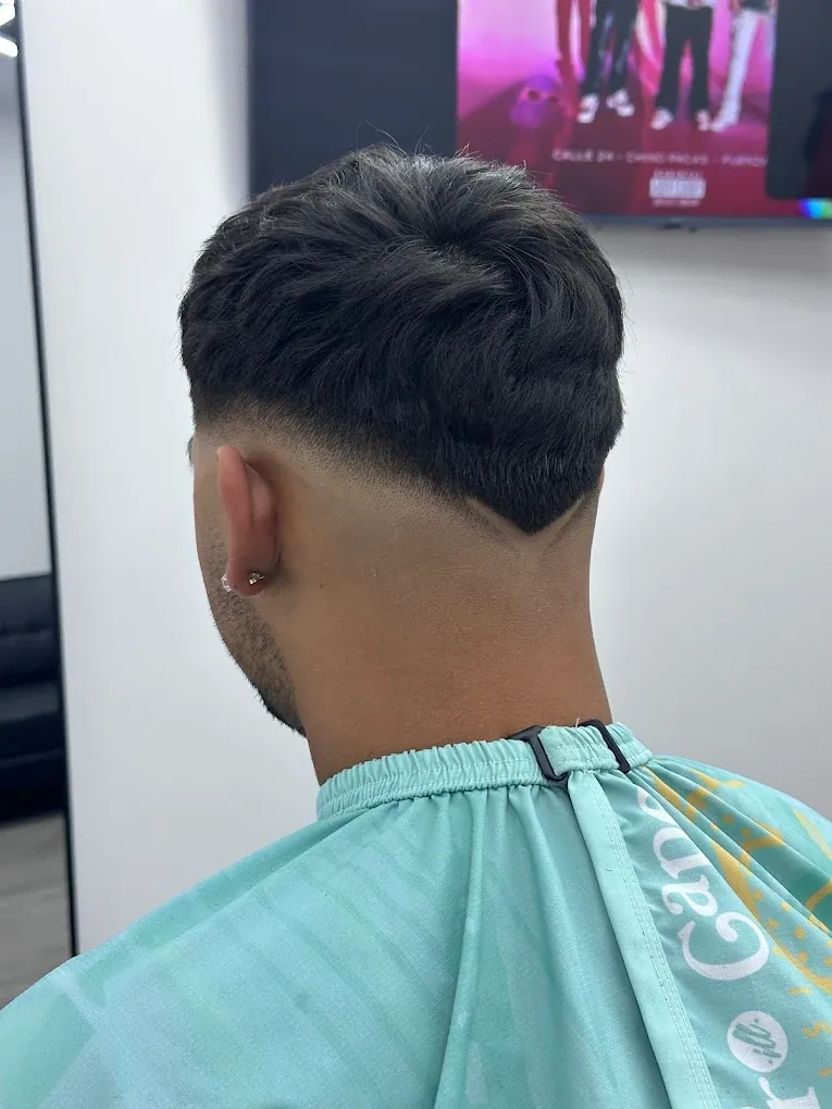 Back view of a taper fade with a defined V-shaped neckline